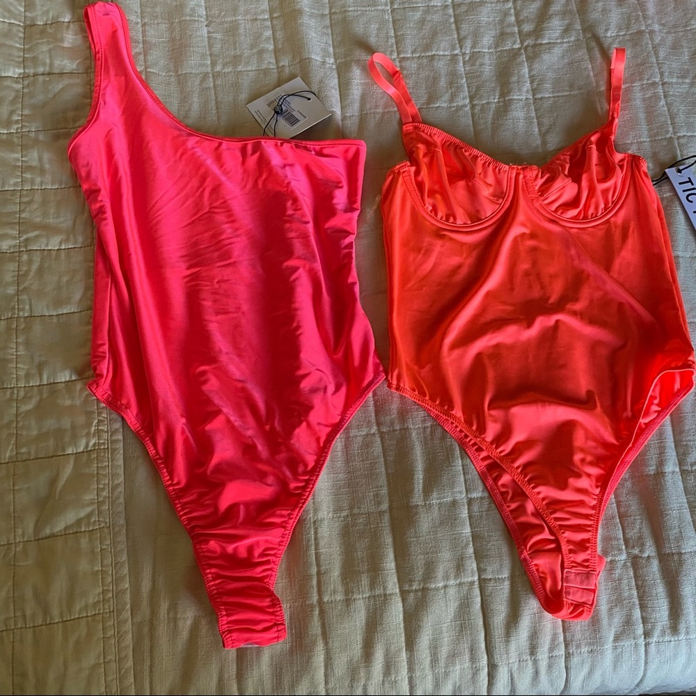 Two neon bodysuits